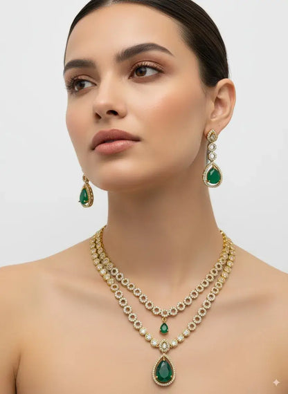Woman wearing a green and gold necklace and earrings on a plain background