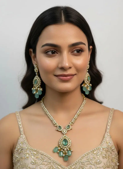 Pastel Green Kundan Necklace Set with Earrings for Women worn by a model, showcasing elegance with teardrop pendant and matching earrings.