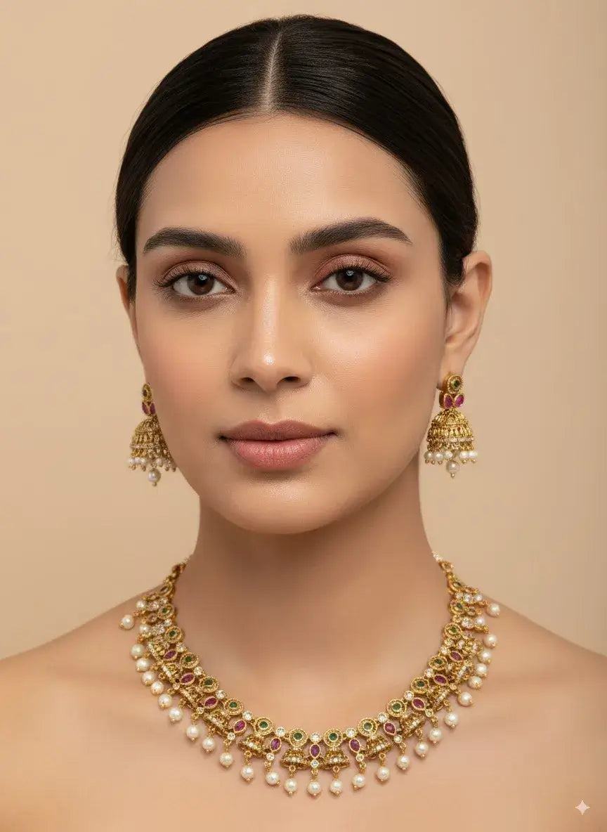 Traditional Multicolor Pearl Necklace Set with Jhumka Earrings worn by a model, featuring green and magenta stones.