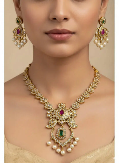 Royal Kundan Pearl Necklace Set with Multicolor Stones & Earrings worn by model, featuring intricate designs and pearl drops.