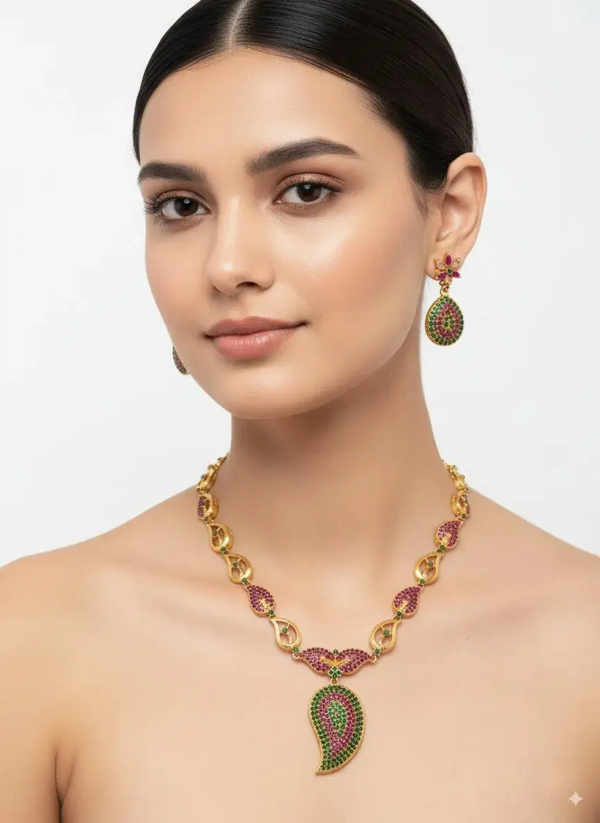 paisley design multicolor necklace set with earrings showcased on model, featuring green and magenta stones.