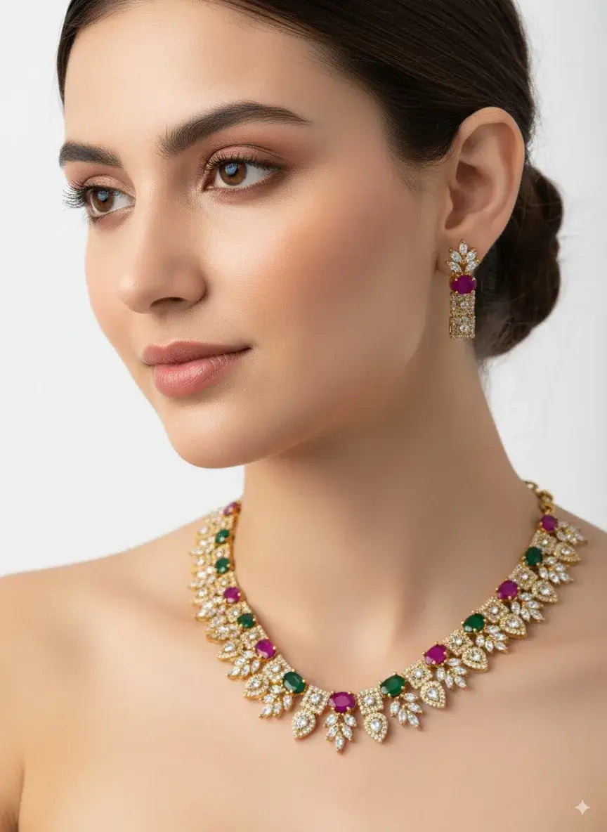 multicolor cz necklace set with green & magenta stones adorning model's neck with matching earrings.