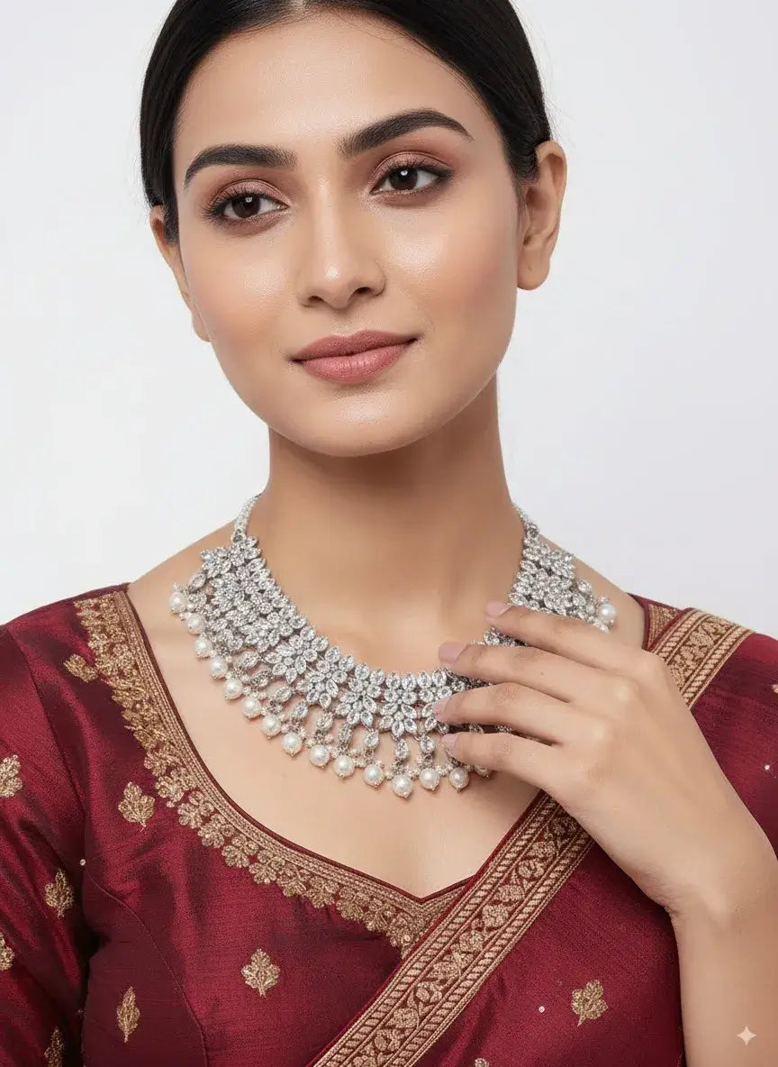 cz diamond bridal pearl choker necklace set with earrings worn by a model in traditional attire.