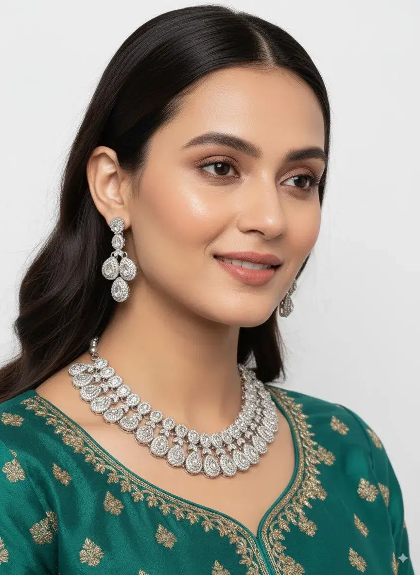 heavy bridal cz diamond choker necklace set with long earrings worn by model in green outfit.
