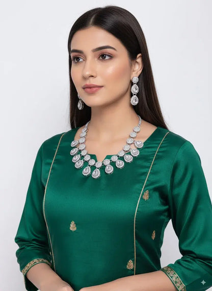 Royal CZ Diamond Drop Necklace Set with Earrings worn with a green outfit, featuring a bold teardrop design.