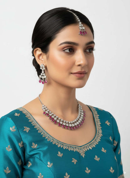 Ruby Red Drop CZ Necklace Set with Earrings & Maang Tikka worn by a model in stylish outfit.
