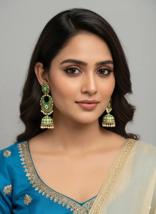 Gehna Green Enamel Jhumka Earrings with Pearl Drops – Designer Traditional Jewellery for Women worn by a model.
