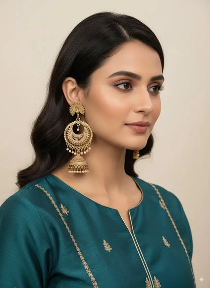 Gold Plated Heavy Jhumka Earrings for Women | Traditional Ethnic Indian Jewelry worn by model in elegant attire.
