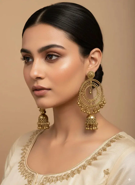 Gold Plated Big Round Hoop Jhumka Earrings for Women | Bridal & Party Wear worn by a model in traditional attire.