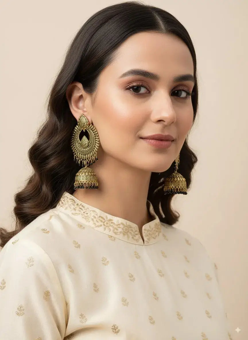 Gold Plated Antique Jhumka Earrings for Women | Traditional Ethnic Jewelry worn by model in ethnic outfit.