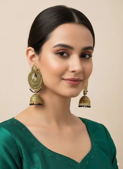 Gold Plated Antique Jhumka Earrings for Women | Traditional Ethnic Jewelry worn by model, showcasing intricate detailing and design.