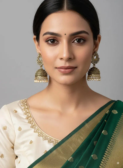 Gold-Plated Pearl Jhumka Earrings – Traditional Ethnic Wedding Jewellery worn with a green and gold saree.