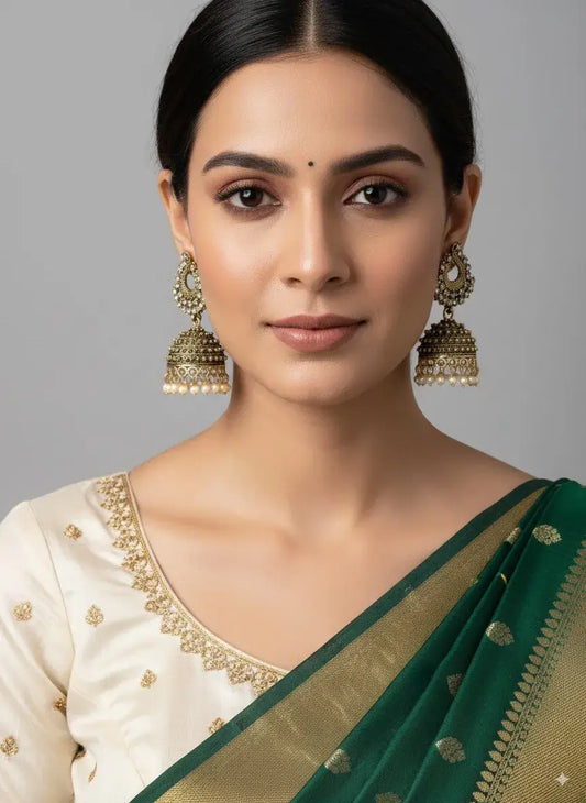 Gold-Plated Pearl Jhumka Earrings – Traditional Ethnic Wedding Jewellery worn with a green and gold saree.