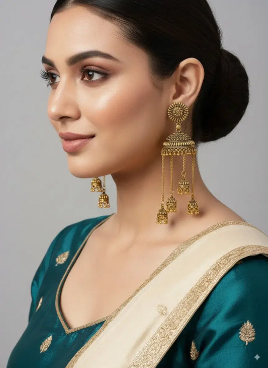 Antique Gold Multi-Layered Long Jhumka Earrings with Hanging Chains – Bridal & Festive Wear worn by model in traditional attire.