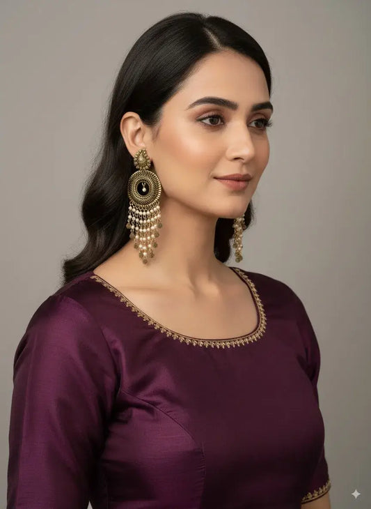 Antique Gold Plated Long Pearl Tassel Earrings – Bridal & Festive Statement Jewellery worn by a model in traditional attire.