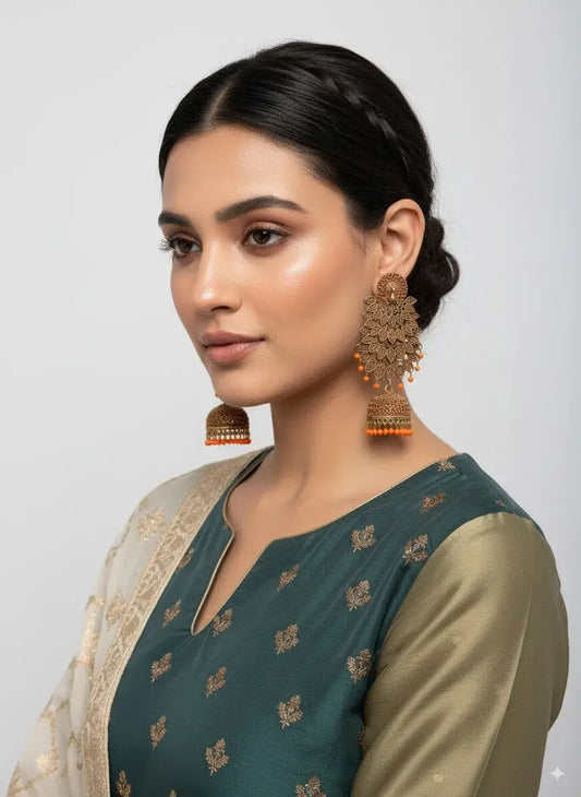 Gold Plated Long Jhumka Earrings with Orange Beads – Ethnic & Bridal Jewellery worn by a woman in traditional outfit.