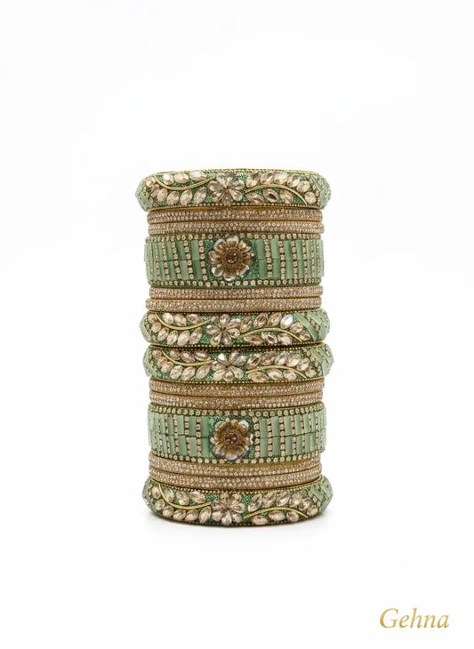 Green Bridal Kundan Floral Bangles Set – Gehna showcasing intricate floral patterns and kundan stones.