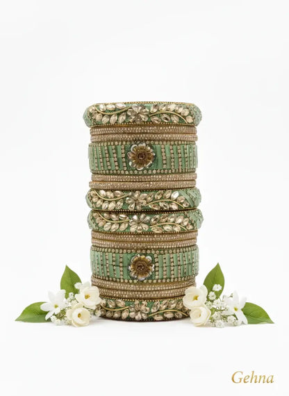 Green Bridal Kundan Floral Bangles Set – Gehna displayed with floral accents.