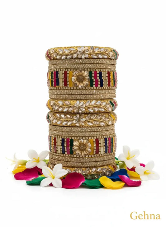Multi-Color Bridal Kundan Bangles Set – Gehna displayed with vibrant petals for a stunning ethnic look.