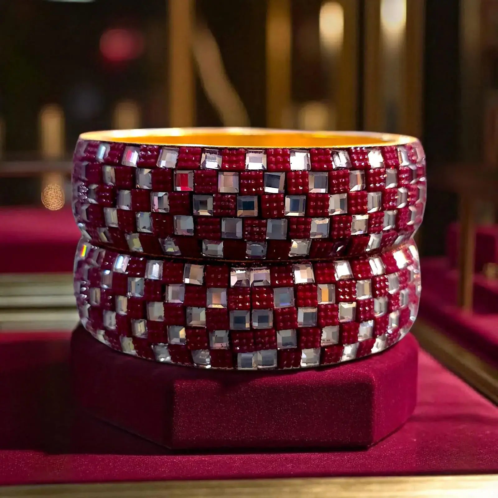 Red checkered designer bangles with sparkling silver stone work, perfect for ethnic partywear.