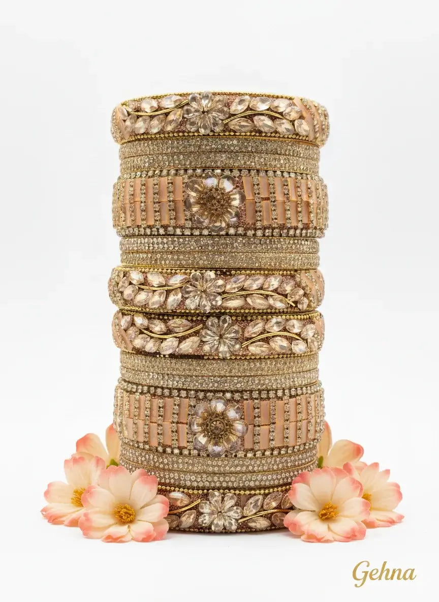 Peach Golden Floral Stone Bangles Set – Designer Bridal & Festive Jewelry beautifully arranged with floral motifs and embellishments.