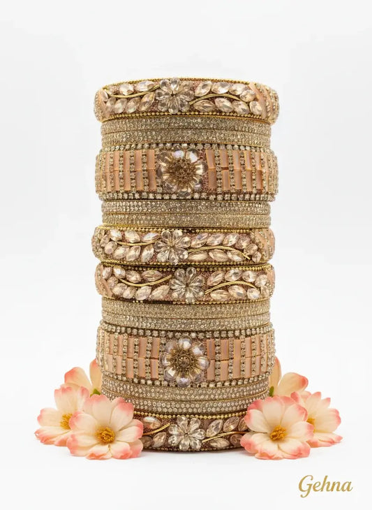 Peach Golden Floral Stone Bangles Set – Designer Bridal & Festive Jewelry beautifully arranged with floral motifs and embellishments.