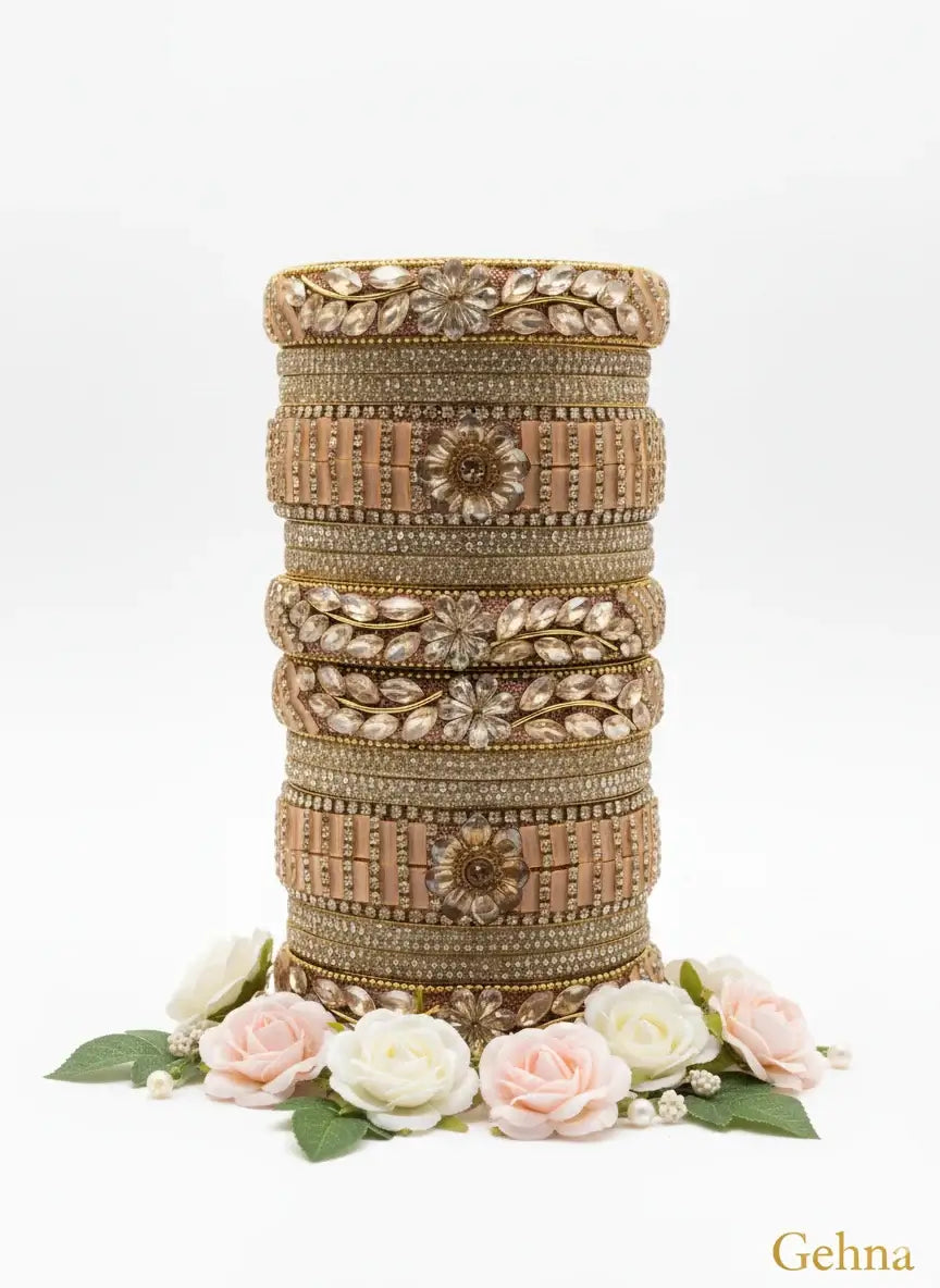 tylish gold plated imitation bangles online | gehna jewellery displayed elegantly with floral accents.