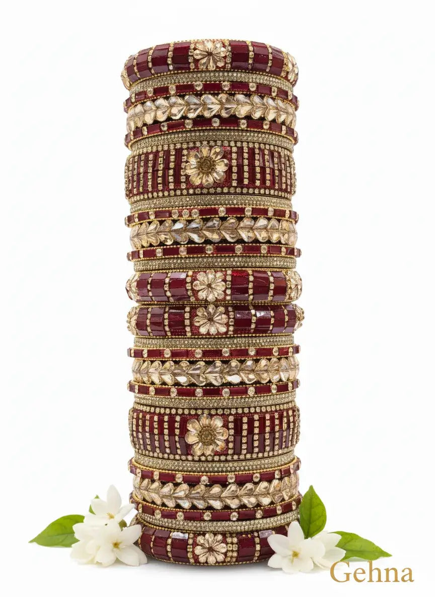 dark red gold bridal bangle set – 26 piece kundan & stone work displayed with floral accents.