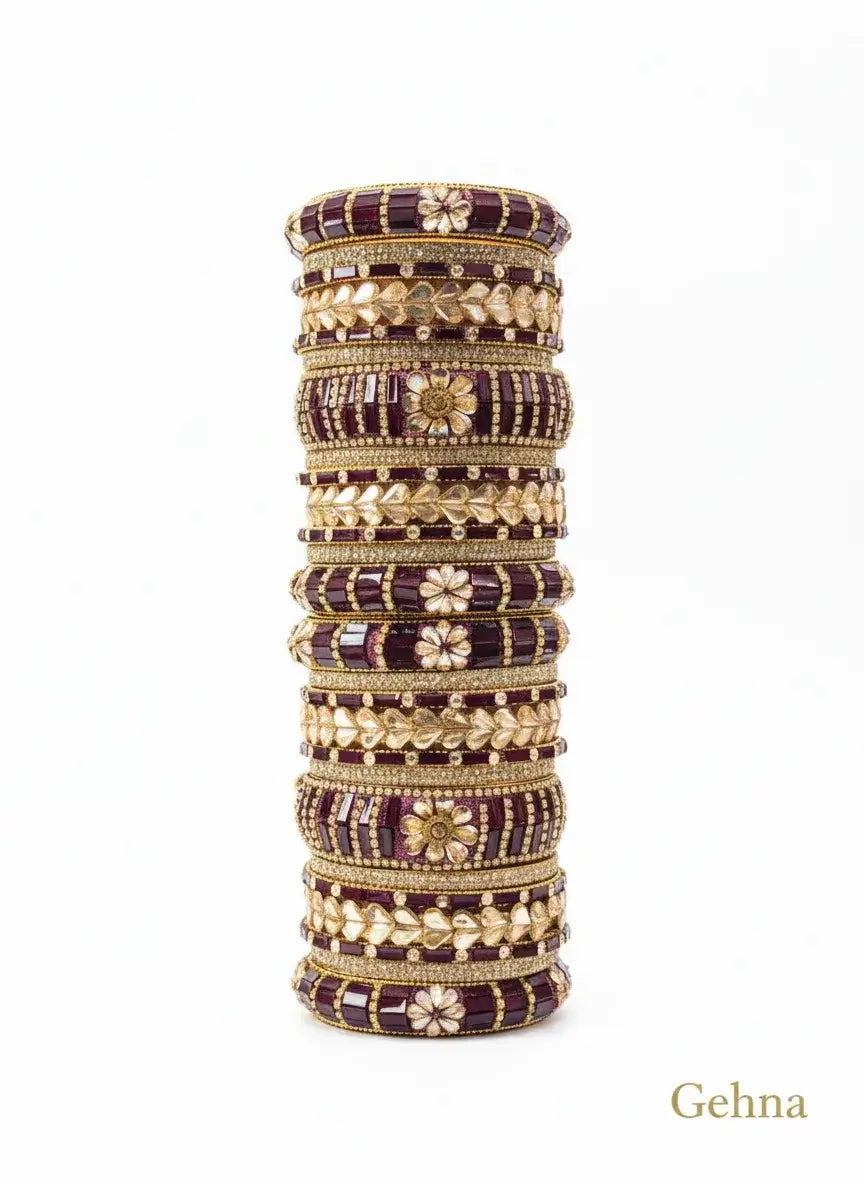 maroon gold bridal bangle set – 26 piece kundan & stone work featuring intricate designs and embellishments.