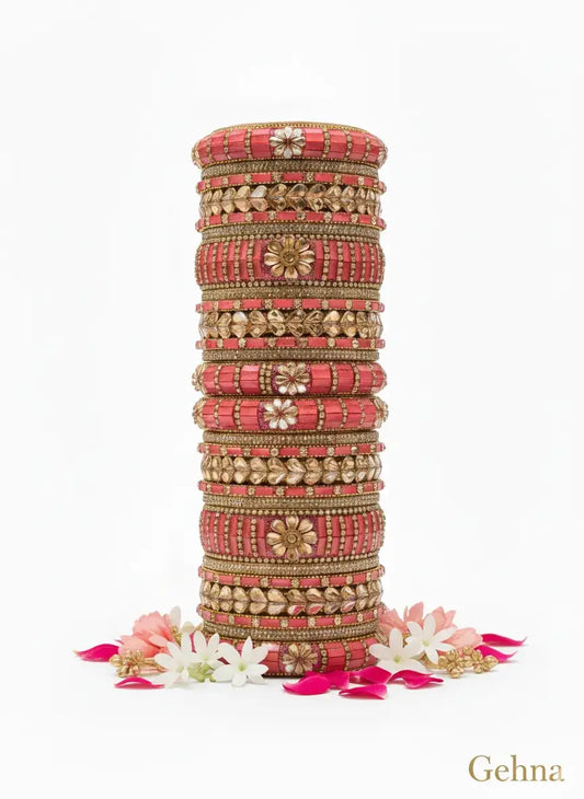 Pink Gold Bridal Bangle Set — 26 Pcs Kundan Stone Work | Gehna displayed on a stand with flowers.