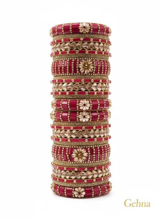 Red Gold Bridal Bangle Set – 26 Piece Kundan & Stone Work displayed elegantly in a stack.