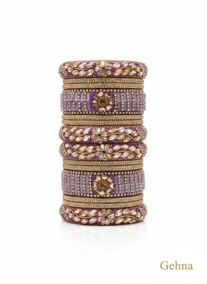 Lavender Bridal Kundan Floral Bangles Set – Gehna featuring floral motifs and golden accents.