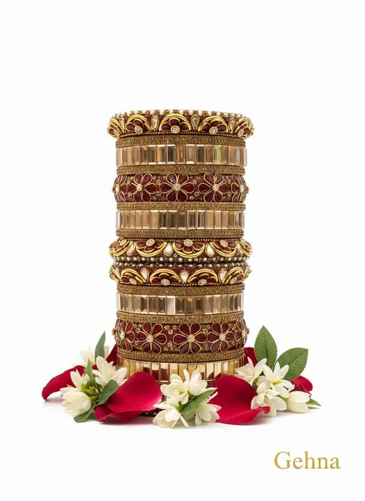Maroon & Gold Bridal Floral Bangles – Premium Ethnic Jewellery Set on display with floral arrangement.