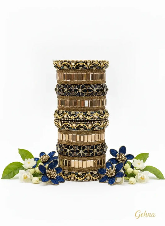 Navy Blue Gold Bridal Floral Stone Bangles Set – Gehna Designer Collection displayed with decorative flowers.