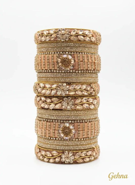 Peach Golden Floral Stone Bangles Set – Designer Bridal & Festive Jewelry with floral motifs and crystal embellishments.