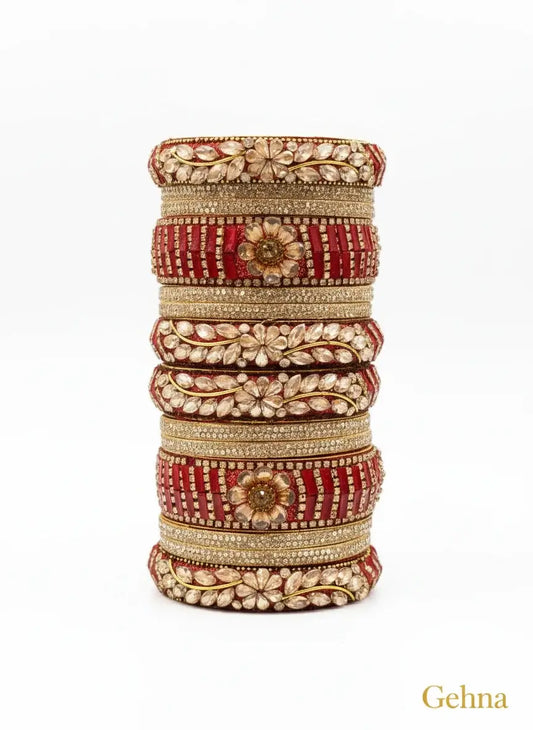 Red Bridal Kundan Floral Bangles Set – Gehna displayed in elegant stacked arrangement, showcasing intricate designs and golden detailing.