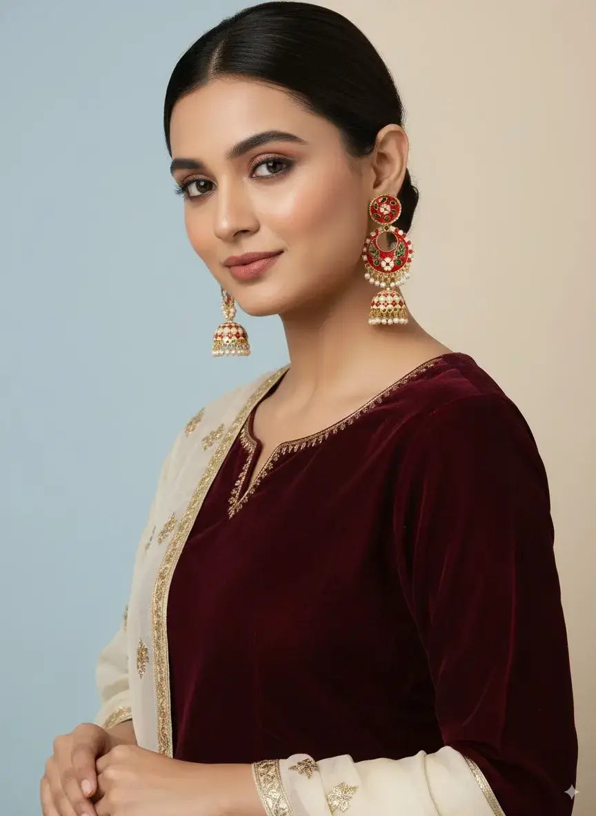 Gehna Red Enamel Jhumka Earrings with Pearl Drops – Premium Ethnic Jewellery for Women worn by a model in traditional attire.